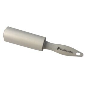 POSHMARK NWOT Limited Edition Lint
Roller in White Black lettering